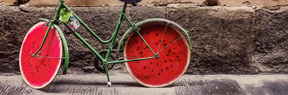 bike with a kickstand next to a wall